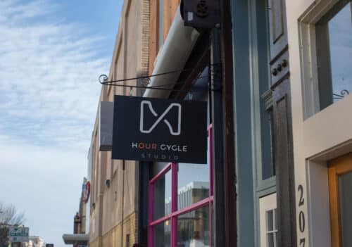 Hour Cycle Studio's sign on the exterior of the building