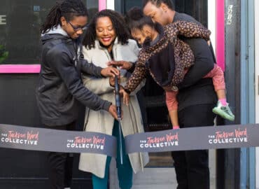 Family of owner at a ribbon cutting for her business