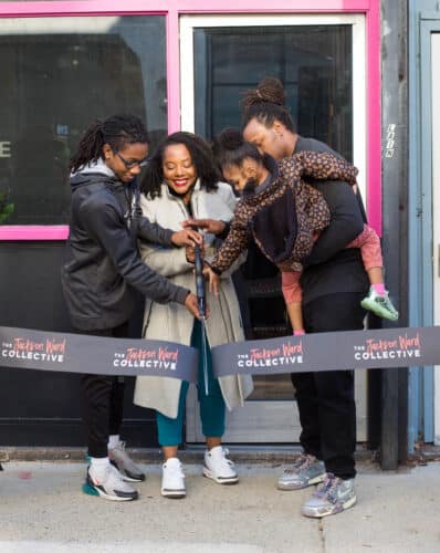 Family of owner at a ribbon cutting for her business